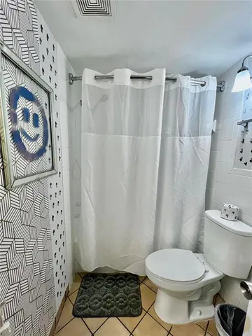 a view of a living room with a couch and chandelier