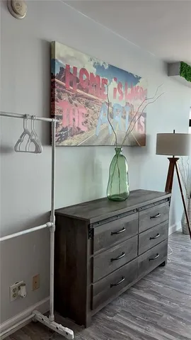 a bedroom with a bed and a mirror