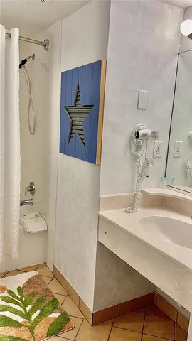 a view of a living room and a floor to ceiling window