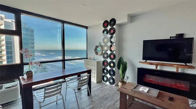 a living room filled with furniture and a window
