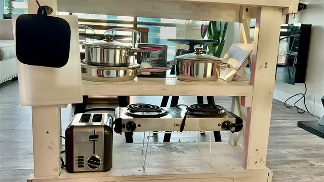 a view of kitchen and empty room