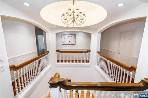 a spacious bedroom with a bed and a couch