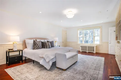 a bedroom with a bed and a fireplace