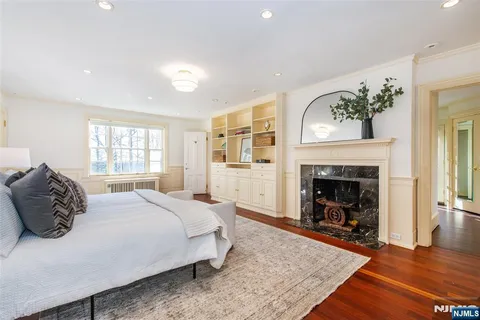 a bathroom with a granite countertop sink mirror and a bath tub