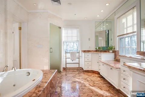 a view of an entryway with wooden floor and a large window