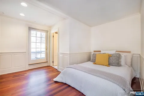 a bathroom with a sink vanity mirror and toilet