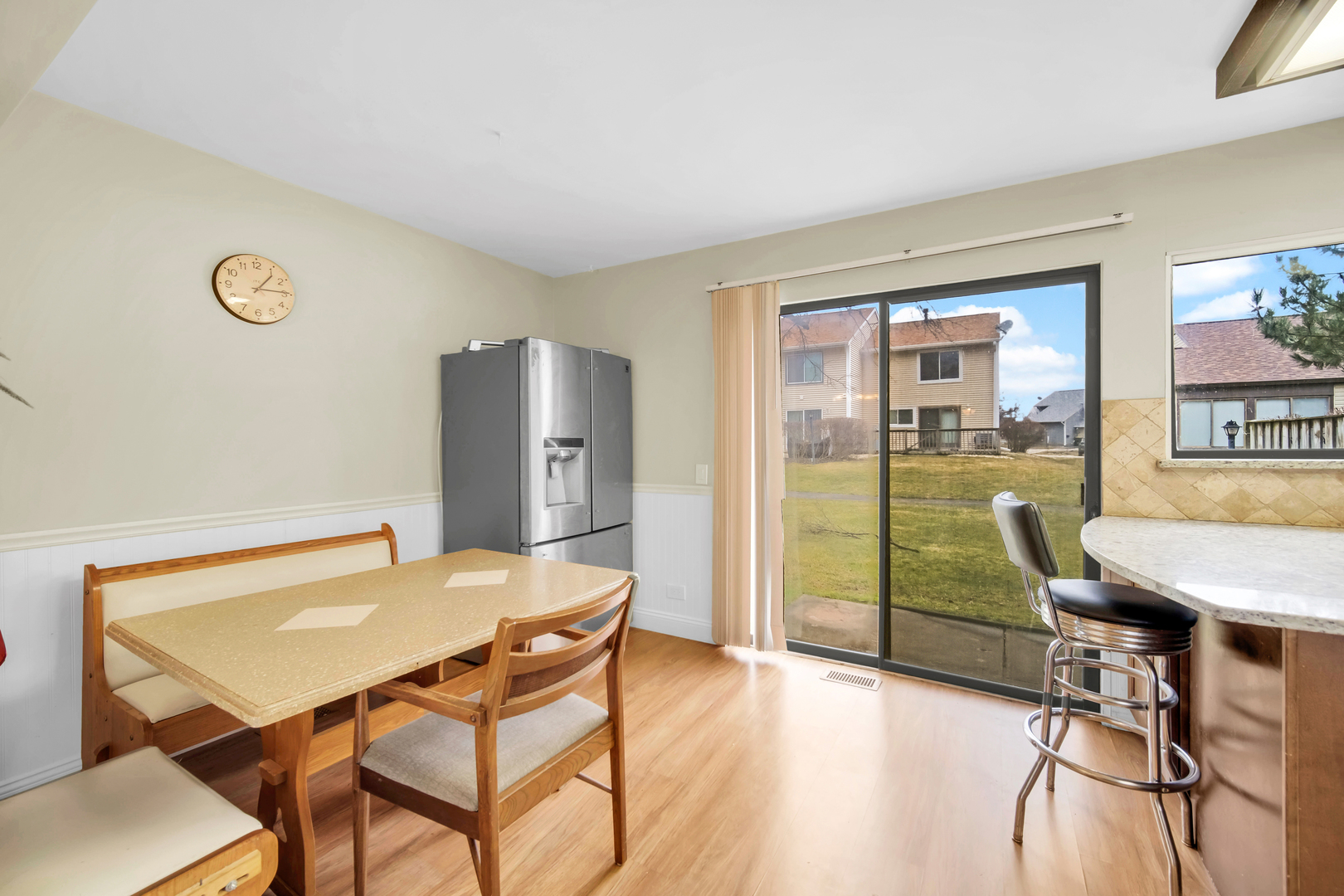 761 Colorado Court Carol Stream, IL 60188 - Photo 11 of 27 a view of a dining room with furniture and a table
