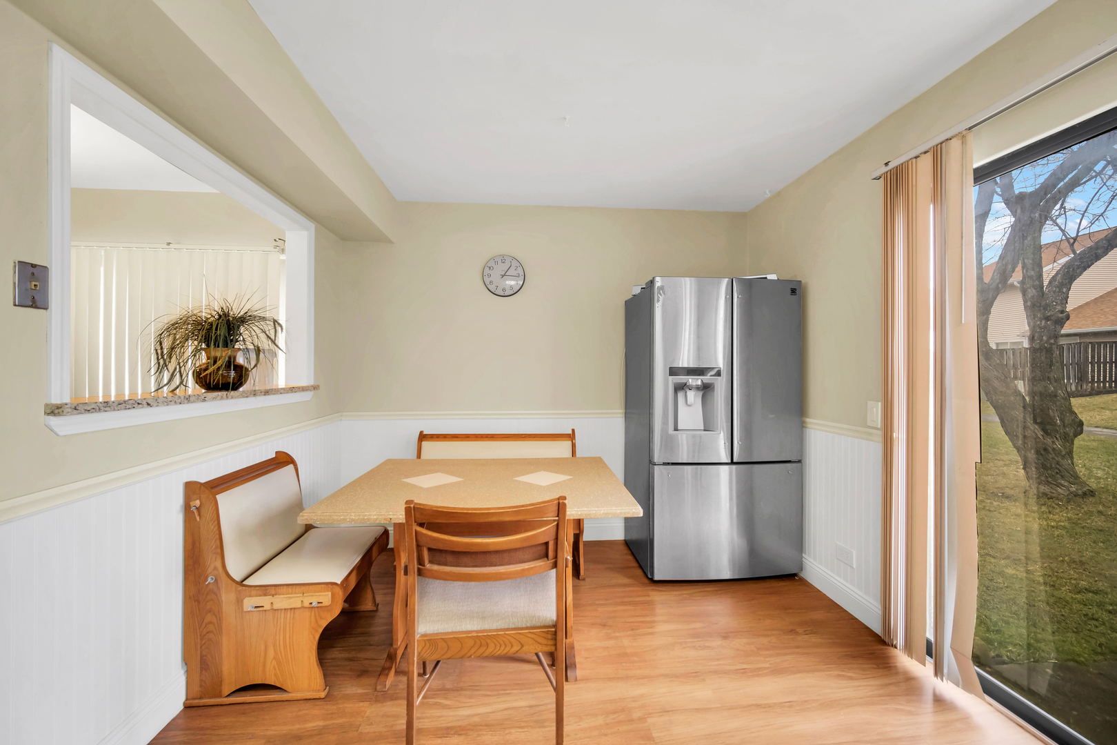 761 Colorado Court Carol Stream, IL 60188 - Photo 12 of 27 a kitchen with stainless steel appliances a refrigerator and a dining table