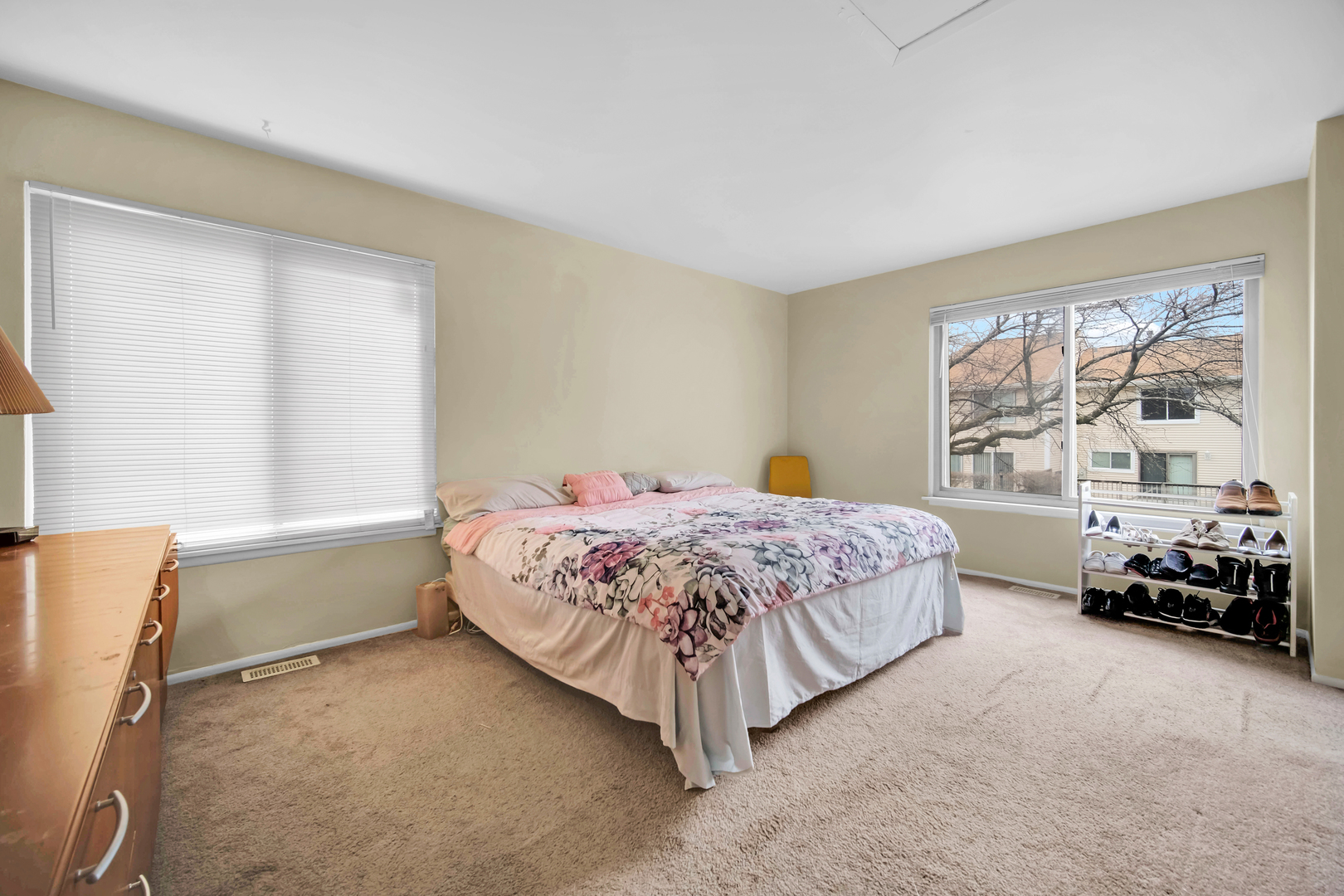 761 Colorado Court Carol Stream, IL 60188 - Photo 14 of 27 a bedroom with a bed and a large window