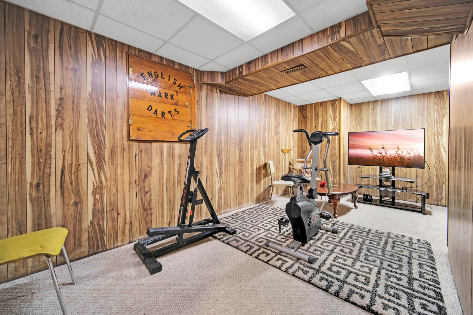 761 Colorado Court Carol Stream, IL 60188 - Photo 19 of 27 a room with gym equipment and a mirror