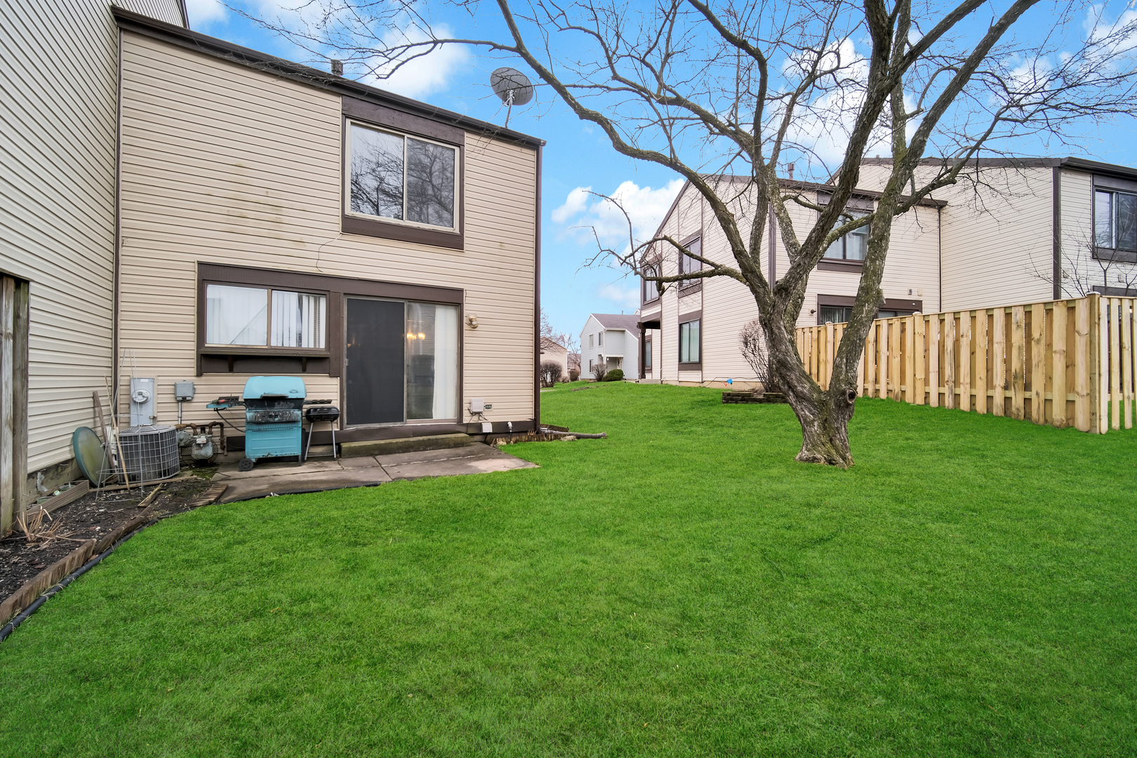 761 Colorado Court Carol Stream, IL 60188 - Photo 22 of 27 a view of a house with backyard and a tree