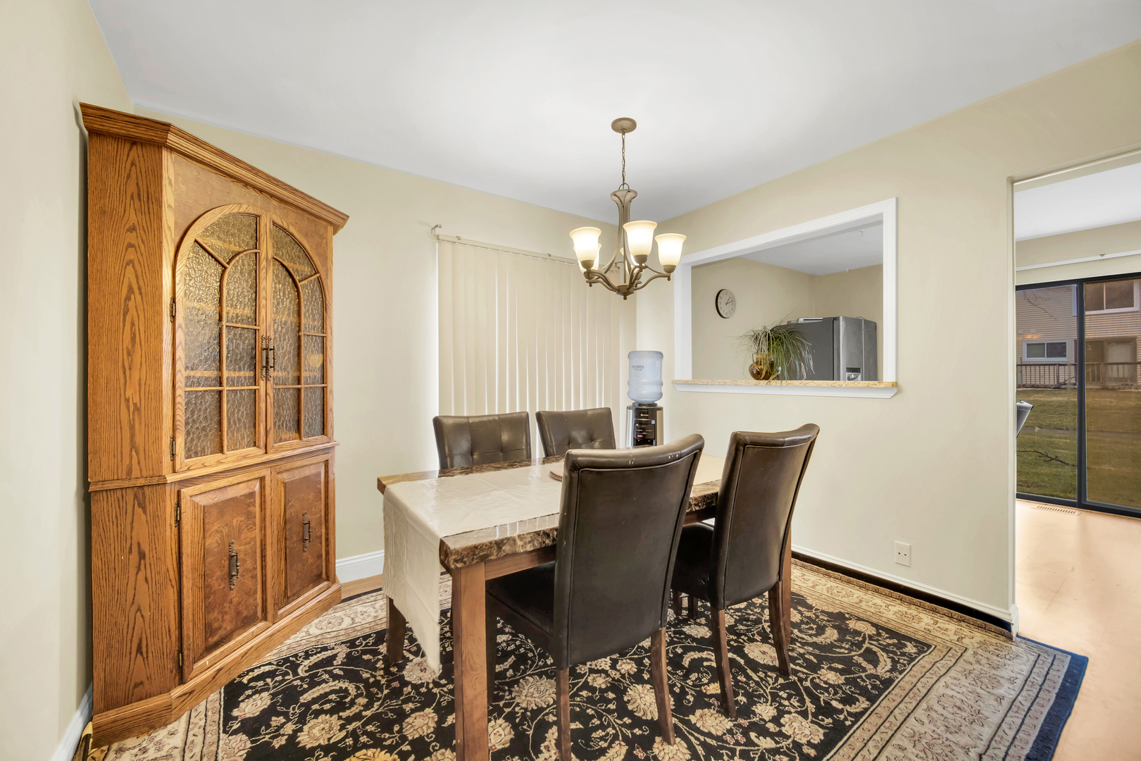 761 Colorado Court Carol Stream, IL 60188 - Photo 7 of 27 a view of a dining room with furniture and wooden floor