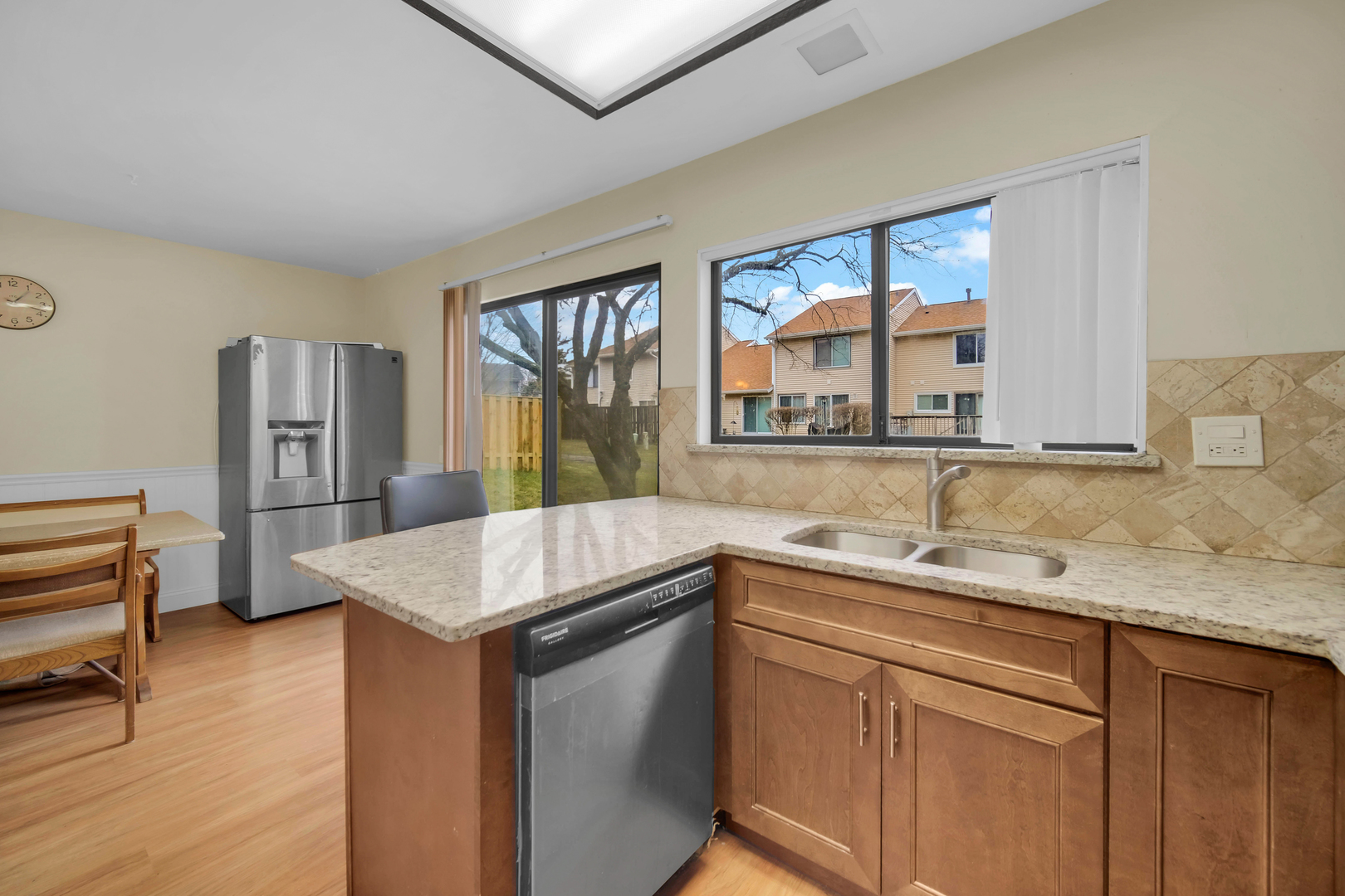 761 Colorado Court Carol Stream, IL 60188 - Photo 10 of 27 a kitchen with a sink stove and refrigerator