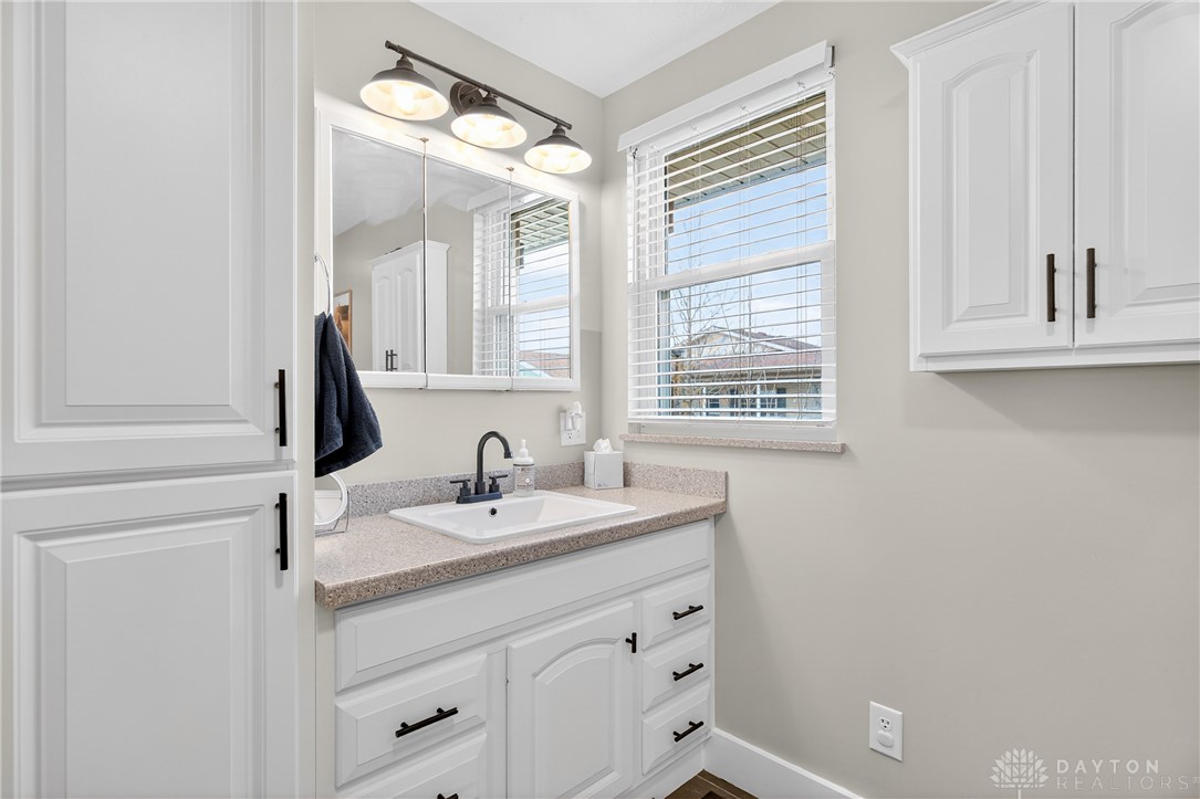 7888 Darke-Preble County Line Road Arcanum, OH 45304 - Photo 30 of 51 This bright bathroom features ample storage, a wide vanity, and natural light.