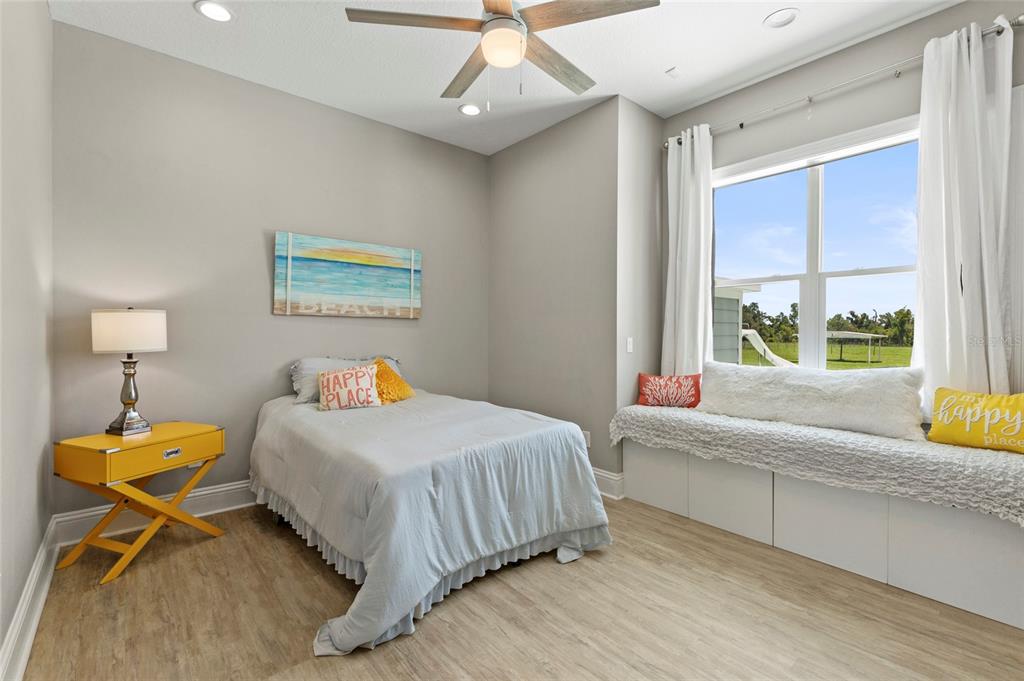 15710 Colding Loop Wimauma, FL 33598 - Photo 20 of 41 a bedroom with a bed and a window