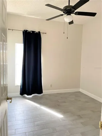a view of a closet with wooden floor