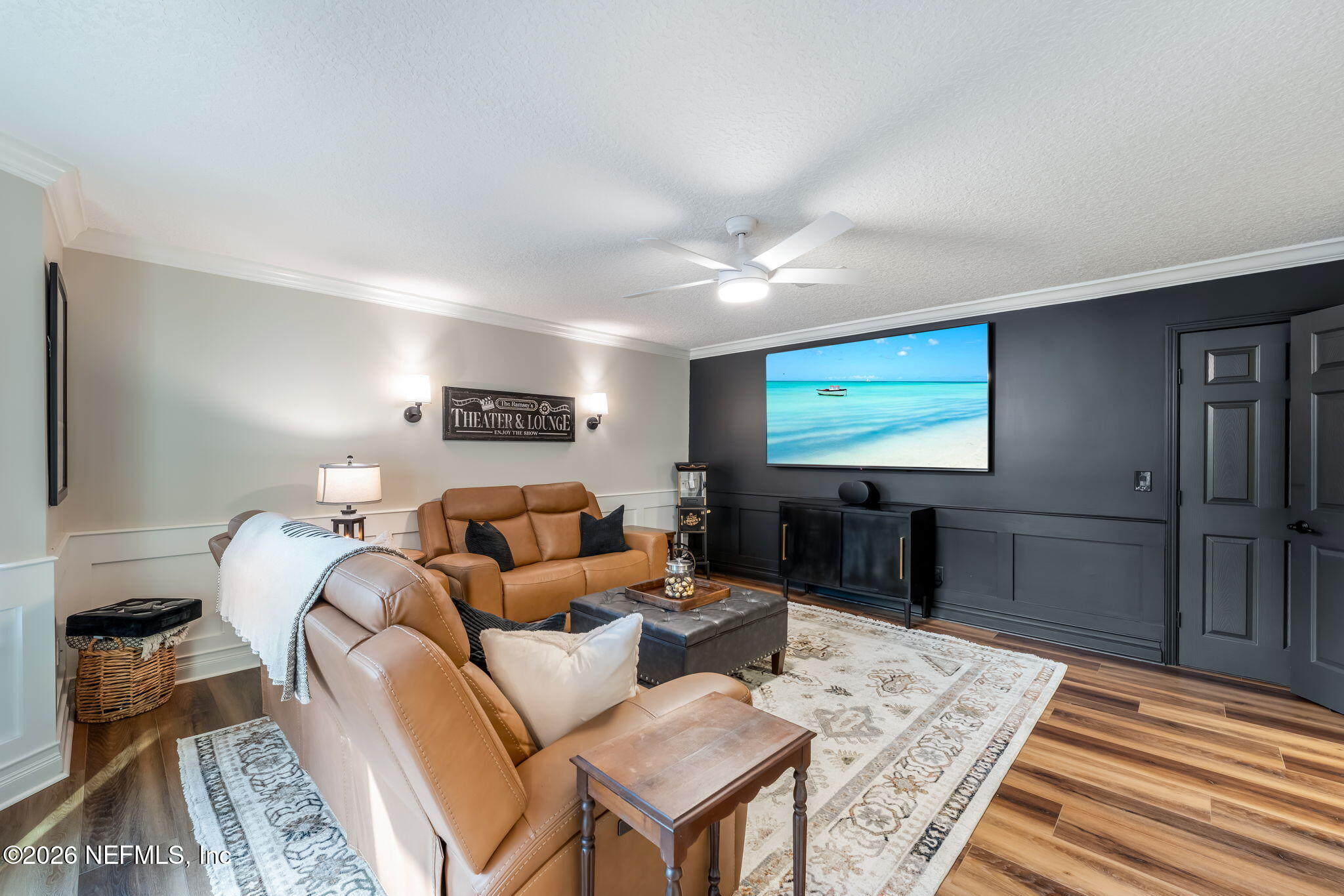 1204 Creek Bend Road St. Johns, FL 32259 - Photo 62 of 107 a living room with furniture a flat screen tv and a table