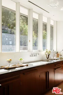 a kitchen with granite countertop a sink and a window