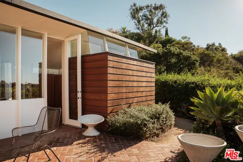 a bathroom with a toilet sink and shower