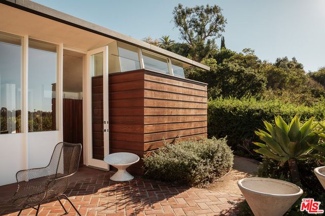 a bathroom with a toilet sink and shower