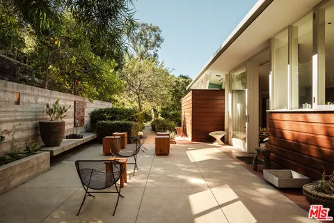 a backyard of a house with seating space