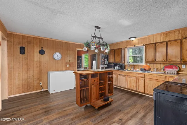 a kitchen with a refrigerator and a sink