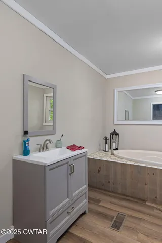 a bedroom with furniture and windows