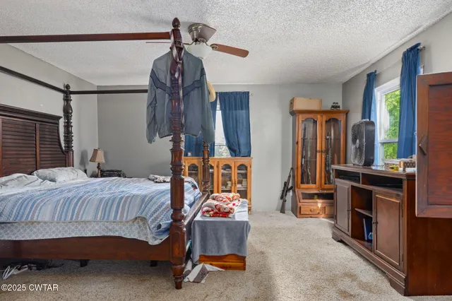 a bedroom with a bed and furniture