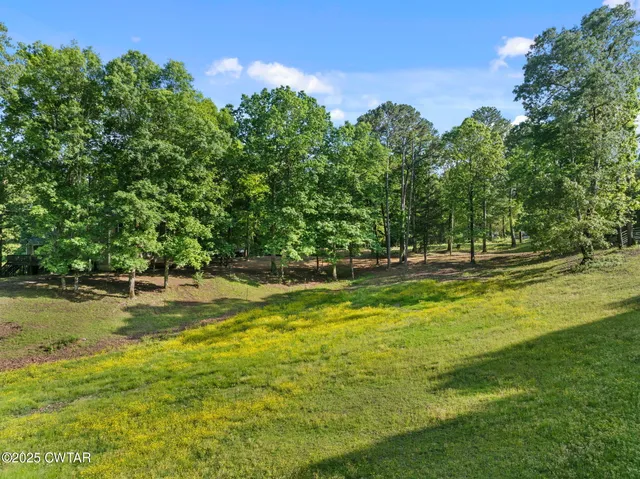 a view of a swimming pool with an outdoor space and seating area