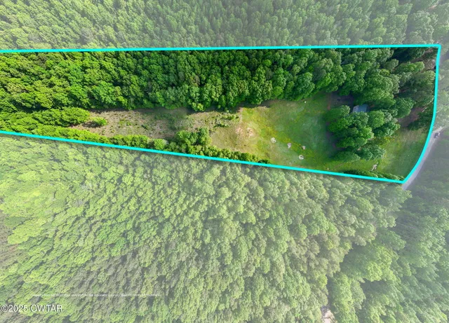 a view of a lake with a yard