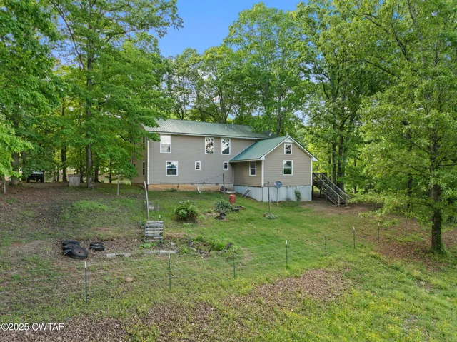 a house view with a backyard space