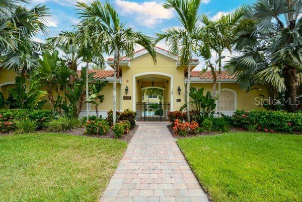 4212 Expedition Way Osprey, FL 34229 - Photo 23 of 28 a front view of a house with garden