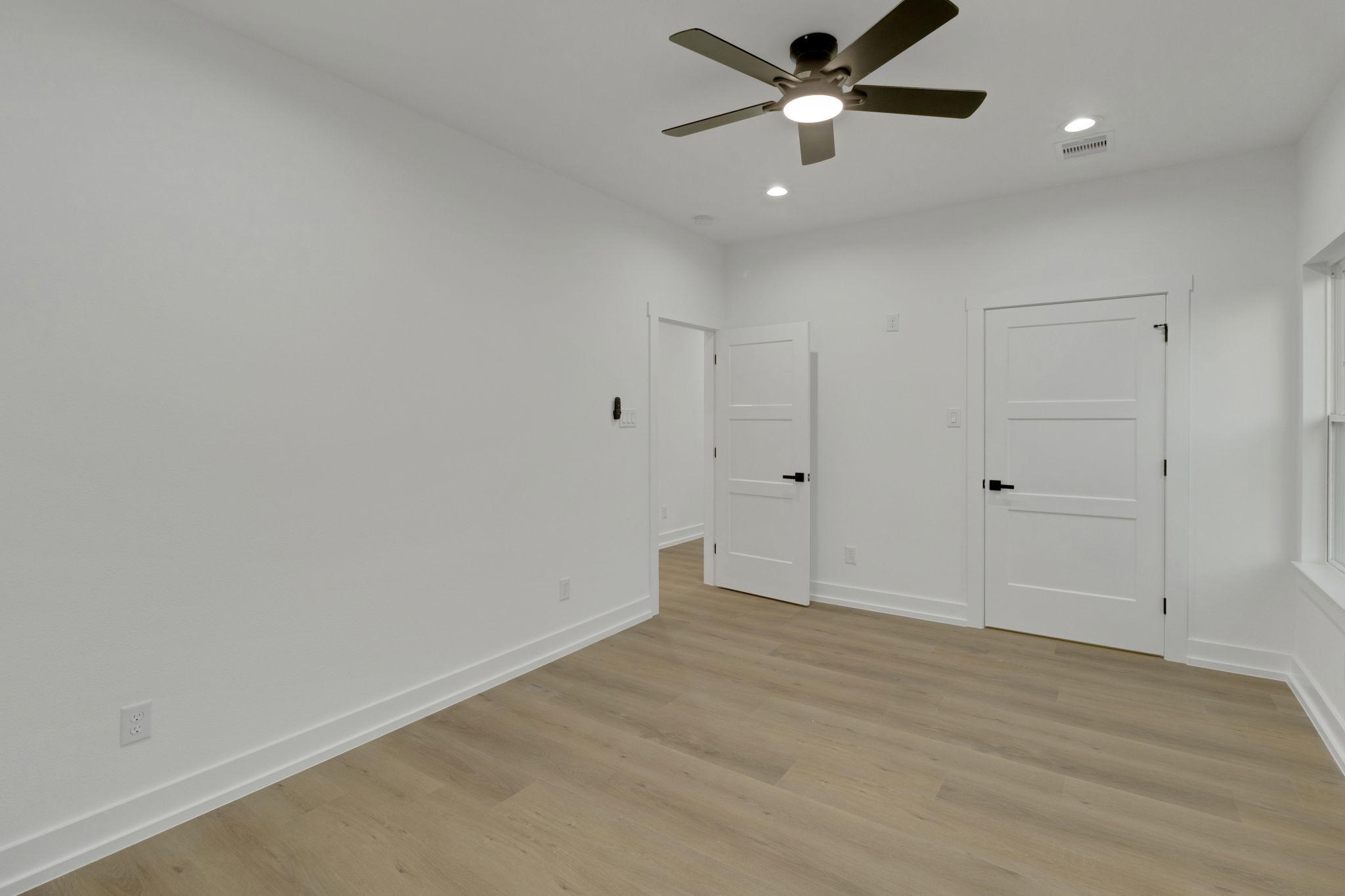 4202 Plaag Street Houston, TX 77016 - Photo 33 of 38 Alternate view of this secondary bedroom with neutral finishes and plenty of space for versatile furniture layouts.