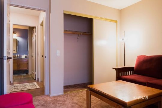 643 North Rio Bravo Street Ridgecrest, CA 93555 - Photo 19 of 29 a bedroom with a bed and a dresser