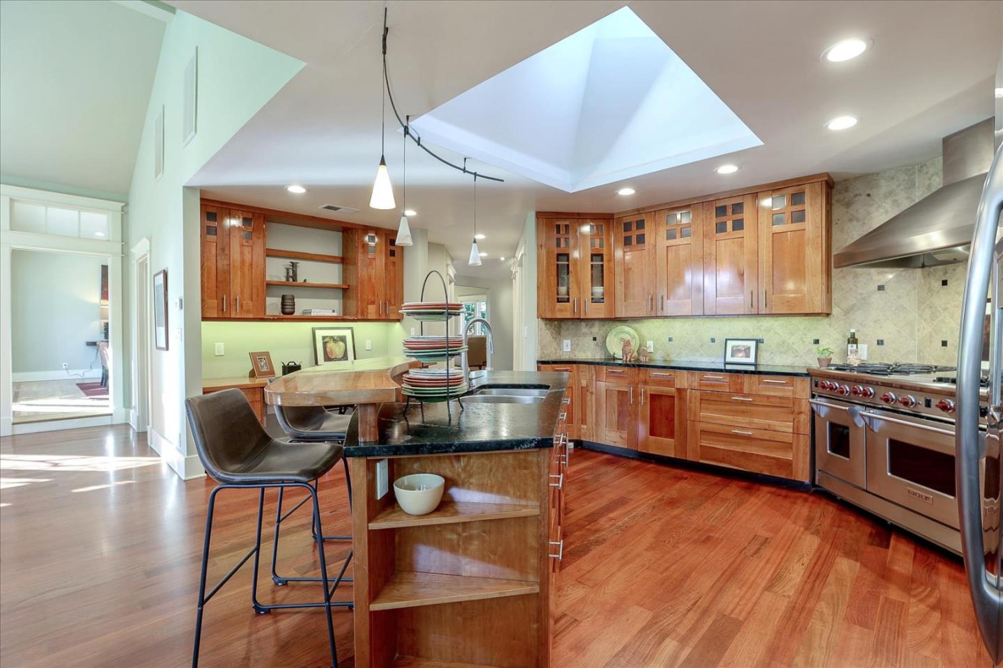 718 Covington Road Los Altos, CA 94024 - Photo 15 of 49 a kitchen with stainless steel appliances granite countertop a stove and a wooden floors