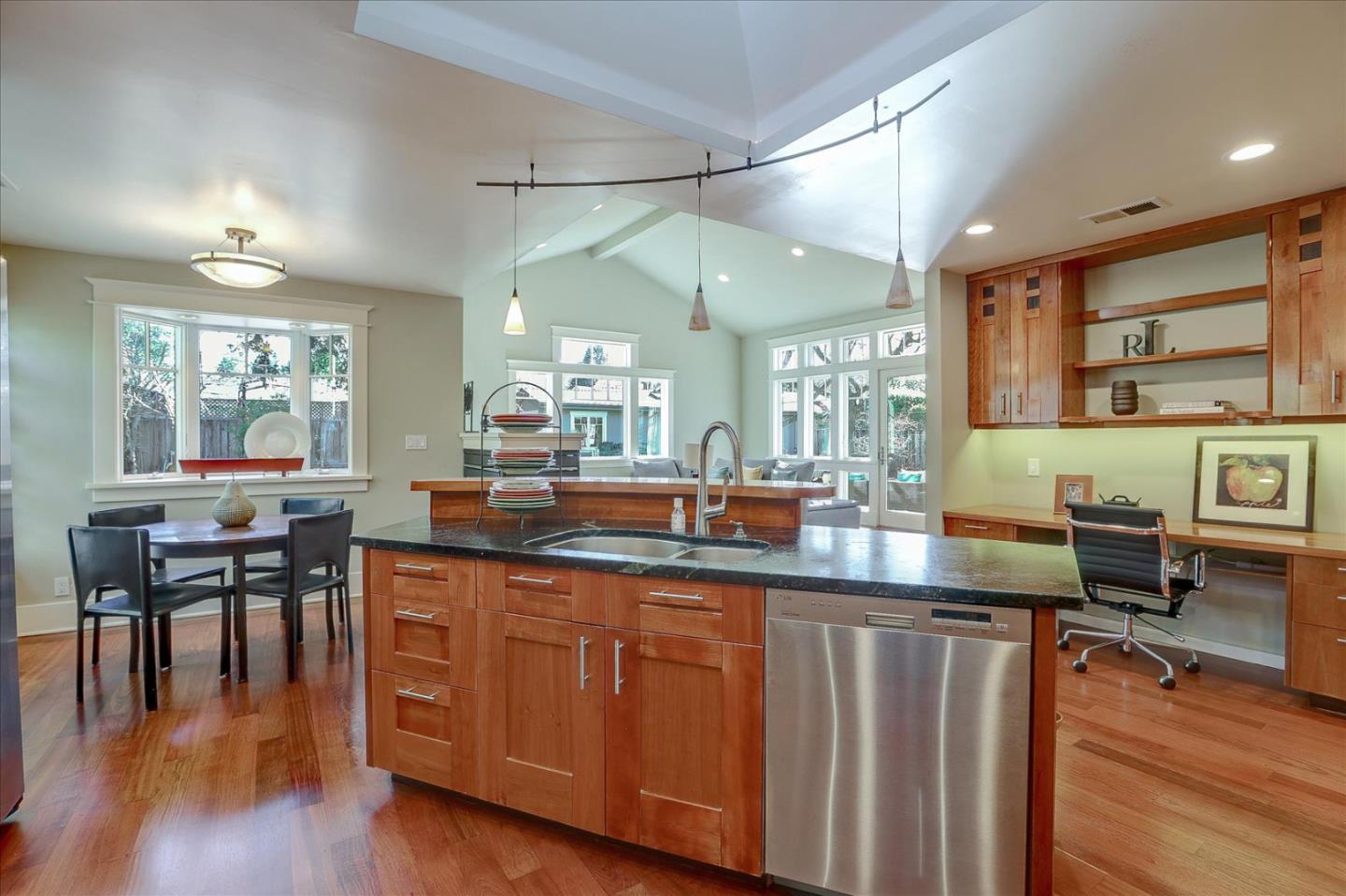 718 Covington Road Los Altos, CA 94024 - Photo 18 of 49 a kitchen with lots of counter top space and painting on the wall