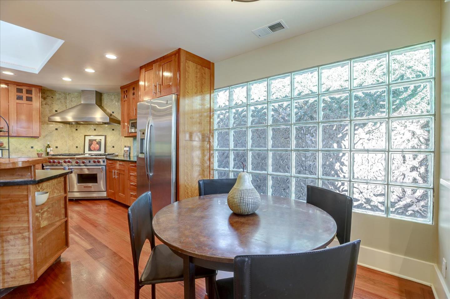 718 Covington Road Los Altos, CA 94024 - Photo 19 of 49 a dining room with furniture a chandelier and wooden floor