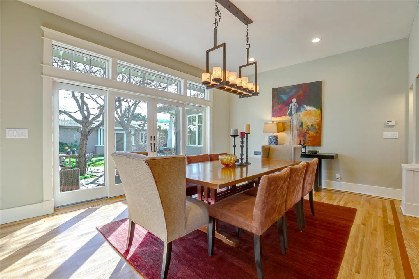 718 Covington Road Los Altos, CA 94024 - Photo 20 of 49 a view of a dining room with furniture wooden floor and chandelier