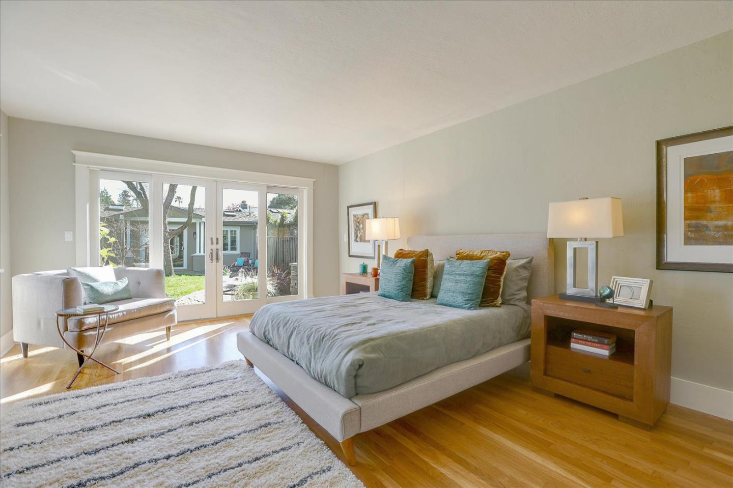 718 Covington Road Los Altos, CA 94024 - Photo 23 of 49 a bedroom with a bed and a night stand