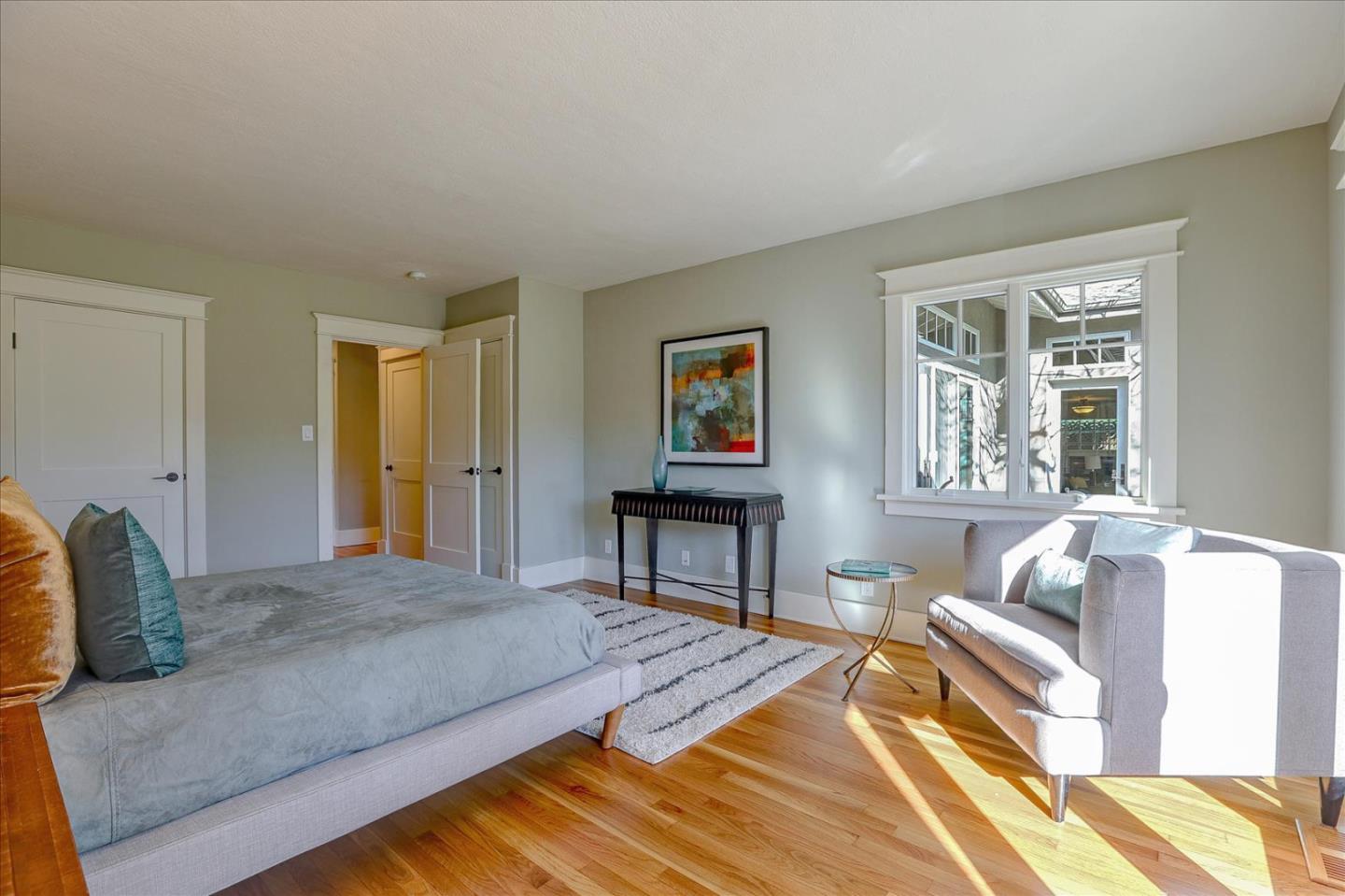 718 Covington Road Los Altos, CA 94024 - Photo 25 of 49 a spacious bedroom with a bed and wooden floor