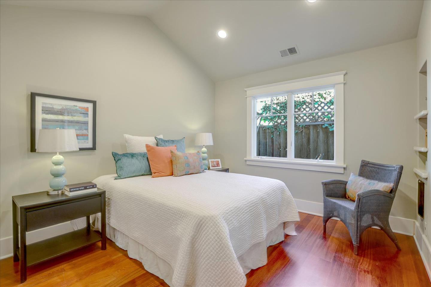 718 Covington Road Los Altos, CA 94024 - Photo 28 of 49 a bedroom with a bed and a lounge chair