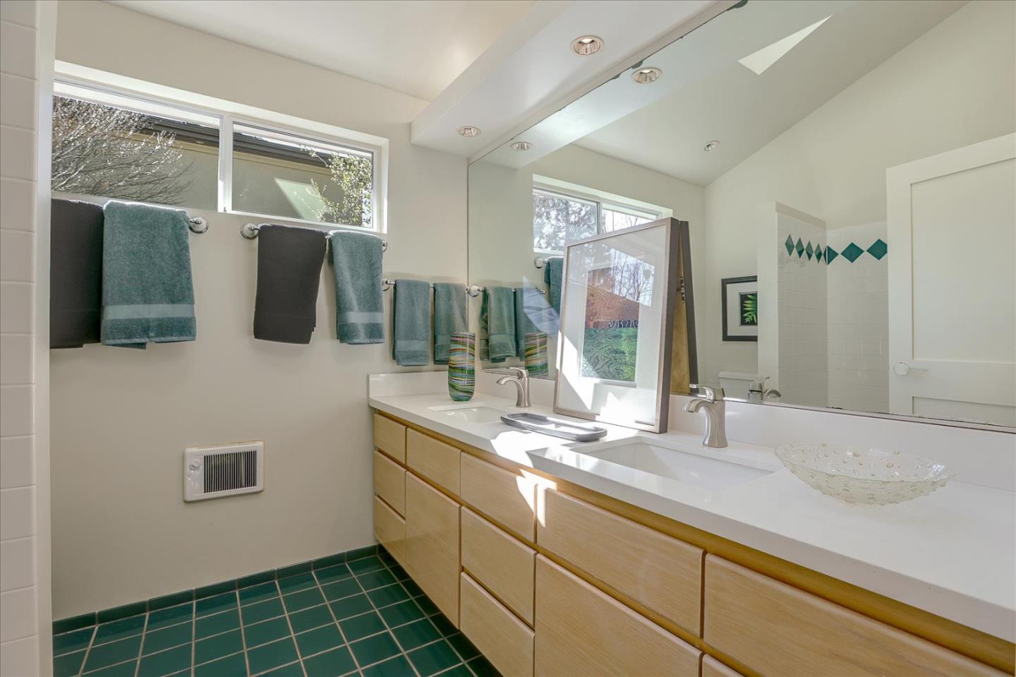718 Covington Road Los Altos, CA 94024 - Photo 31 of 49 a bathroom with a double vanity sink toilet and mirror