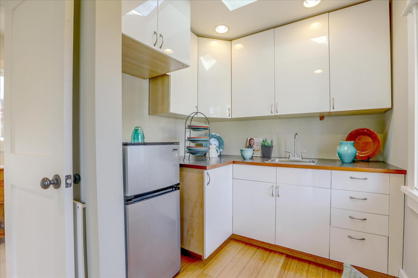 718 Covington Road Los Altos, CA 94024 - Photo 37 of 49 a kitchen with stainless steel appliances white cabinets and a refrigerator