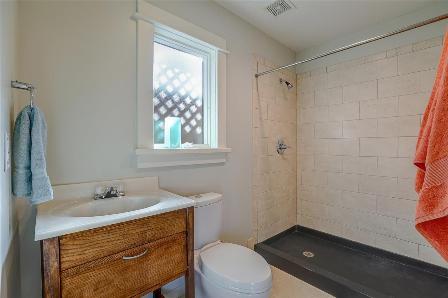 718 Covington Road Los Altos, CA 94024 - Photo 41 of 49 a bathroom with a sink a toilet and shower