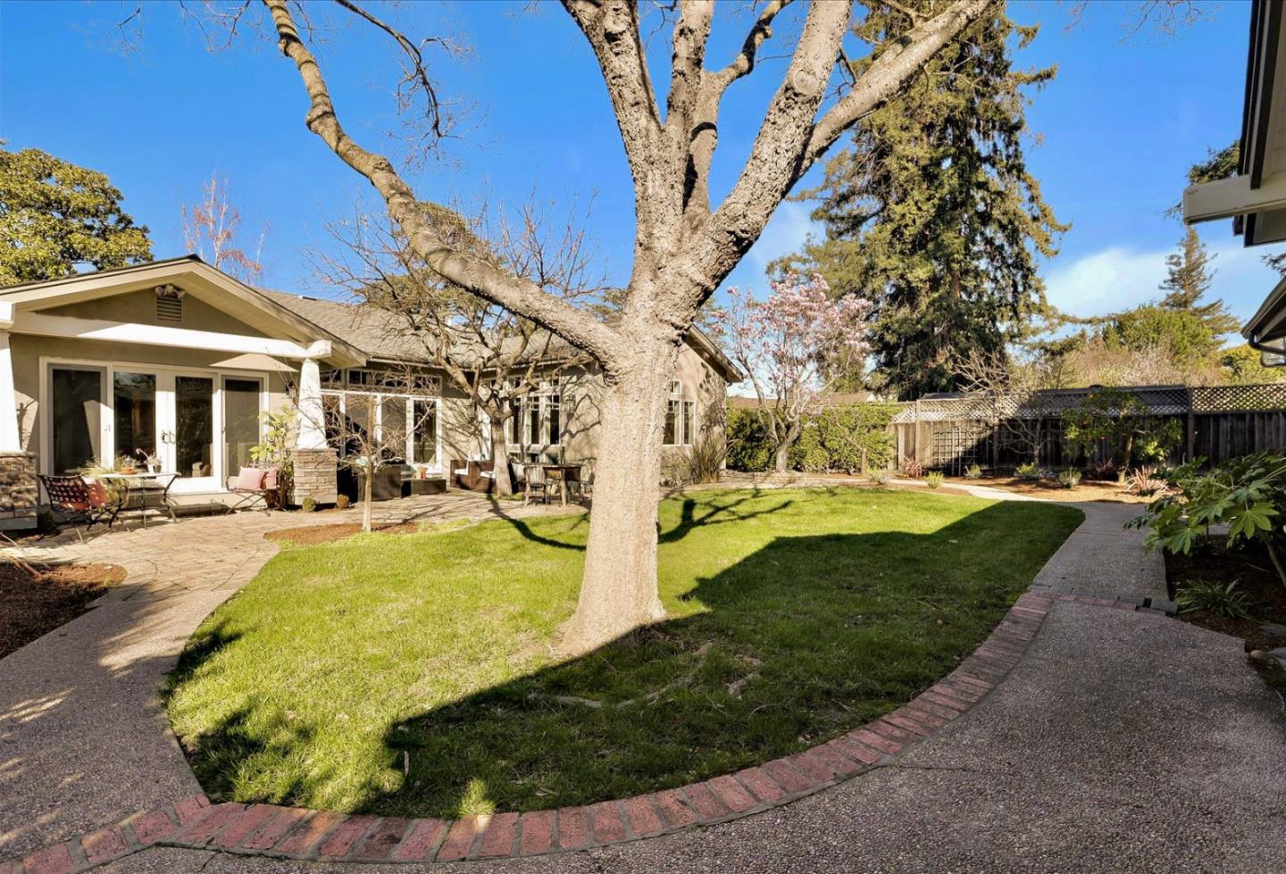 718 Covington Road Los Altos, CA 94024 - Photo 44 of 49 a view of a yard with plants and large trees