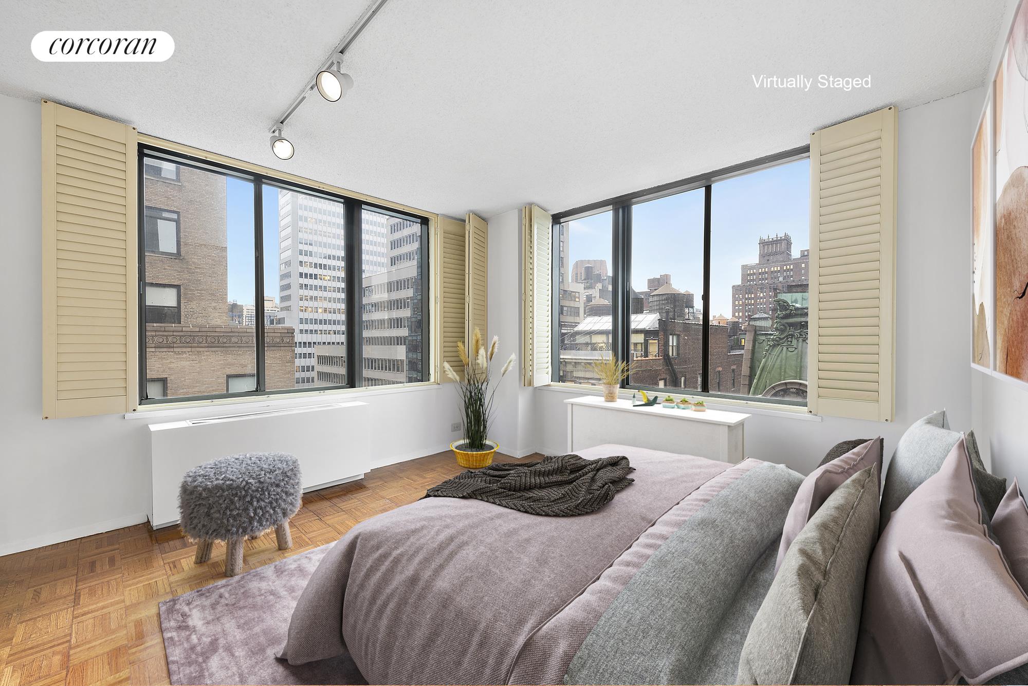 445 5th Avenue, Unit 16F Manhattan, NY 10016 - Photo 4 of 8 a bedroom with a bed and a large window