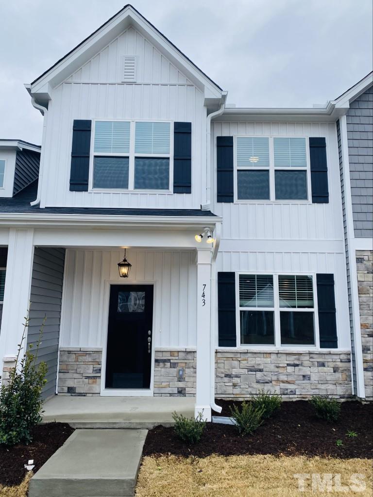 743 Hadstock Path Zebulon, NC 27597 - Photo 1 of 13 a front view of a house with a yard