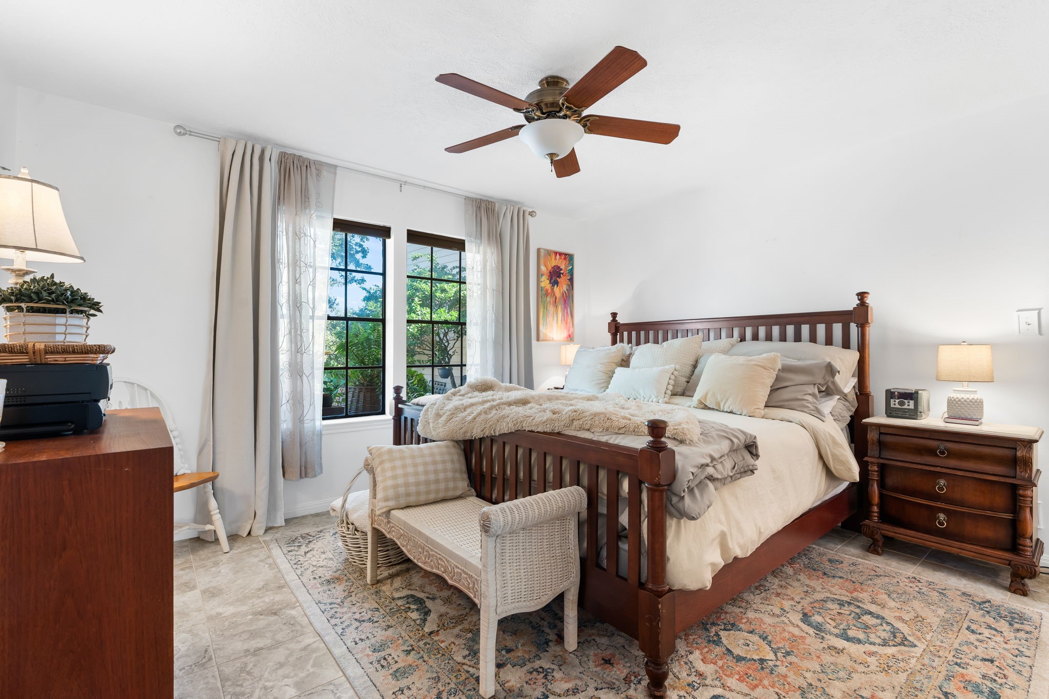 6971 Breezy Point Willis, TX 77318 - Photo 16 of 49 Primary suite is so inviting. Tiled floor and large windows.