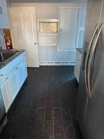 an empty room with a bench