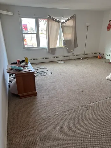 a room with wooden floor and table